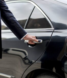 Businessman going inside his car